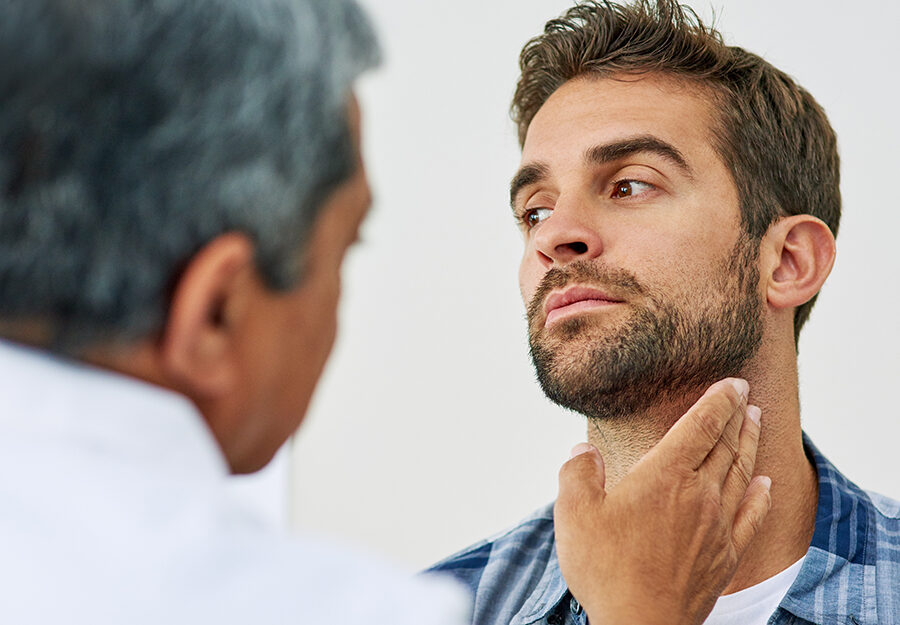 Doctor, hand and man for thyroid with patient, healthcare or diagnosis in clinic. Hospital, help or check up for throat and gland pain for male person, specialist or medical result test for